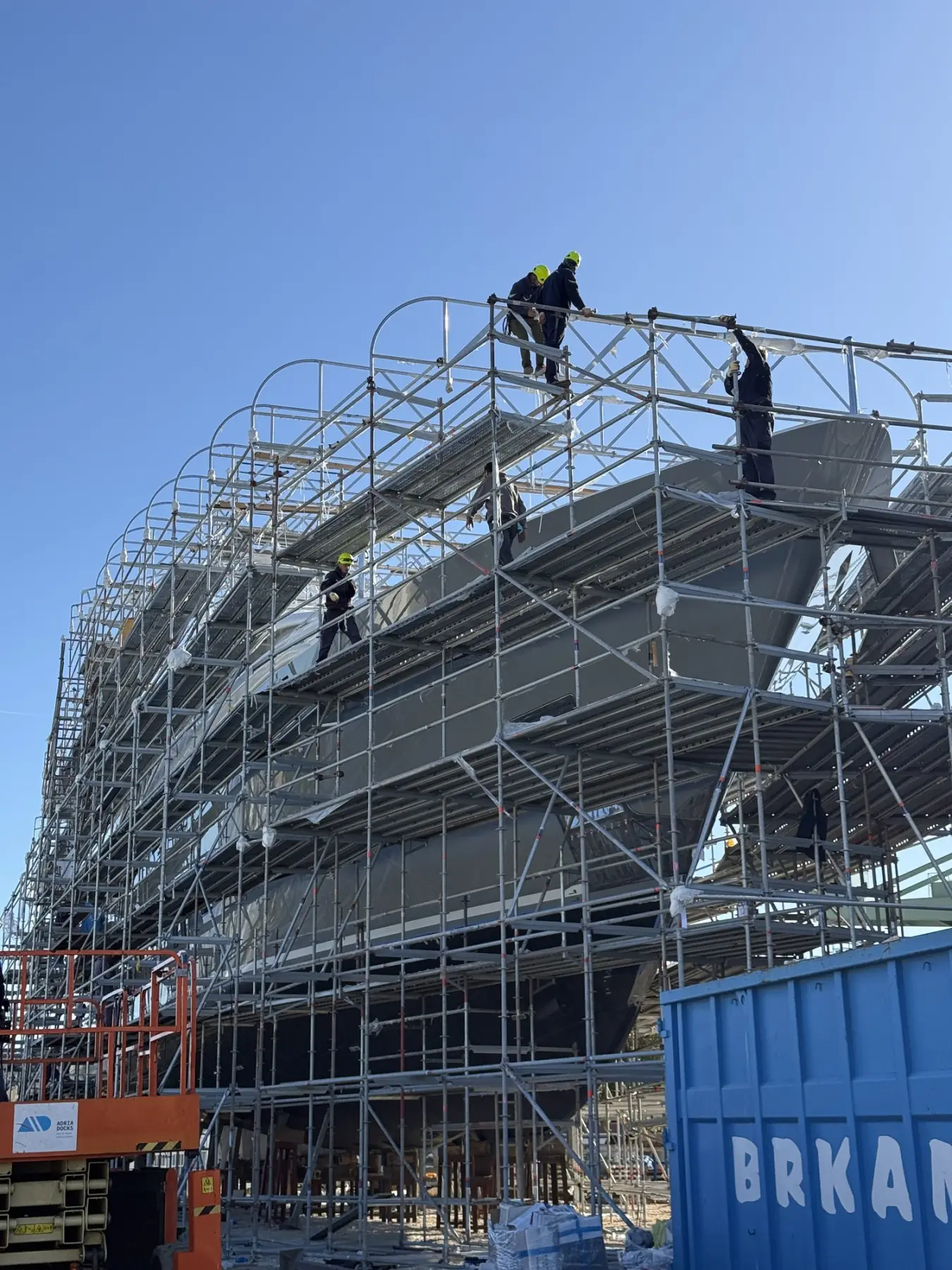 Rossinavi 46 under scaffolding, our crew working on the deck